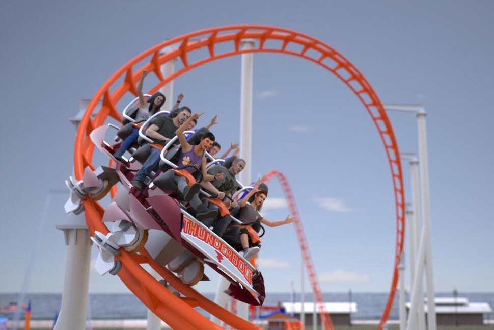 Open loop of a red railed rollercoaster, with a cart towards the bottom of the loop. With a total of 9 passengers distributed across three rows within the cart